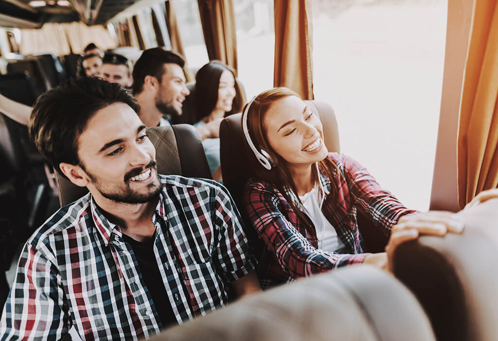 Friends on a group tour bus